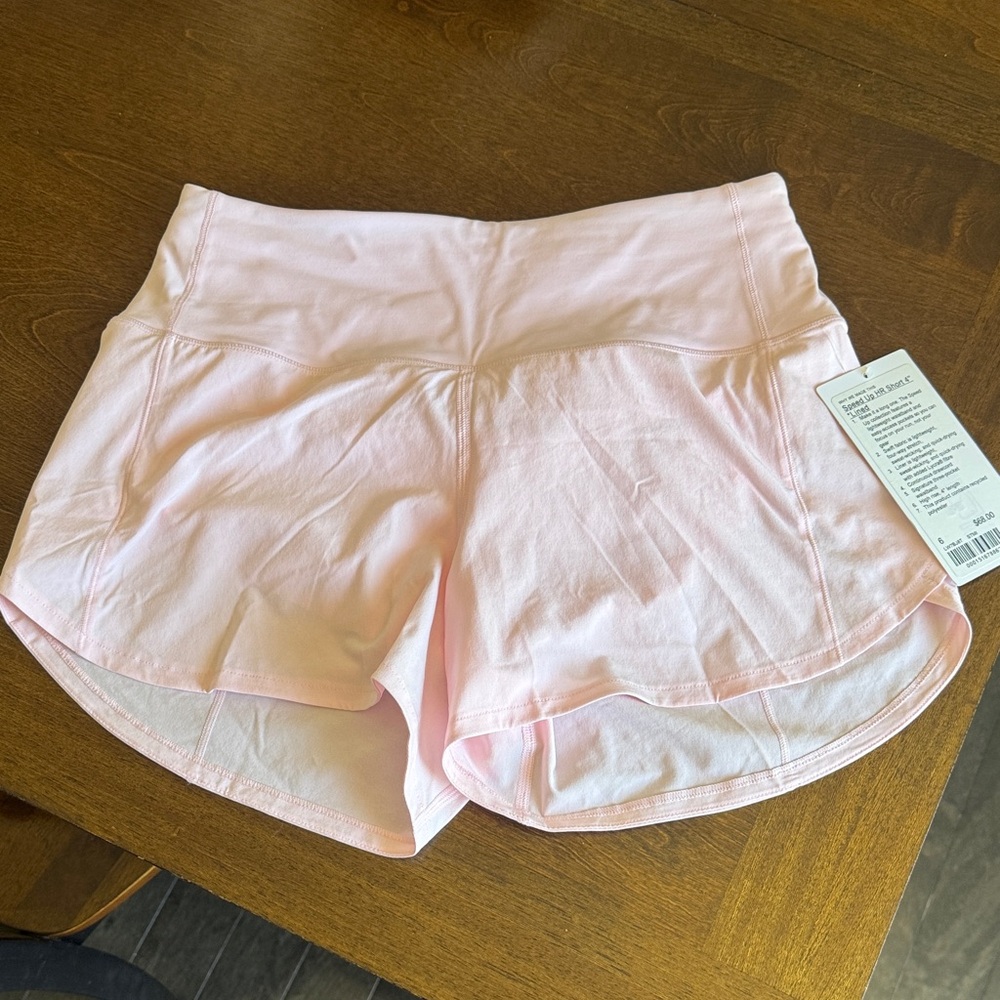 BNWT never worn light pink lululemon speed up HR shorts size 6, 4” length